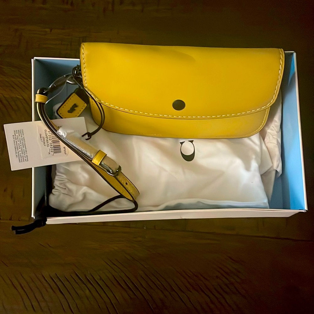 New genuine glove tanned leather Coach clutch.